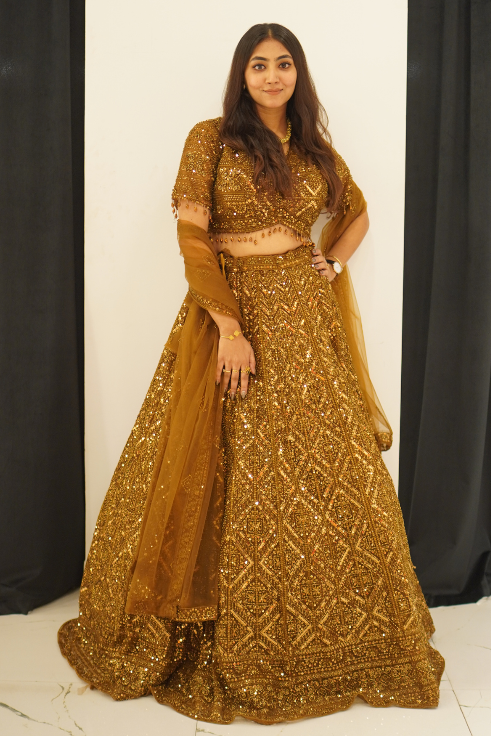 Copper Brown Lehenga With Heavily Embroidered Golden Embellishment