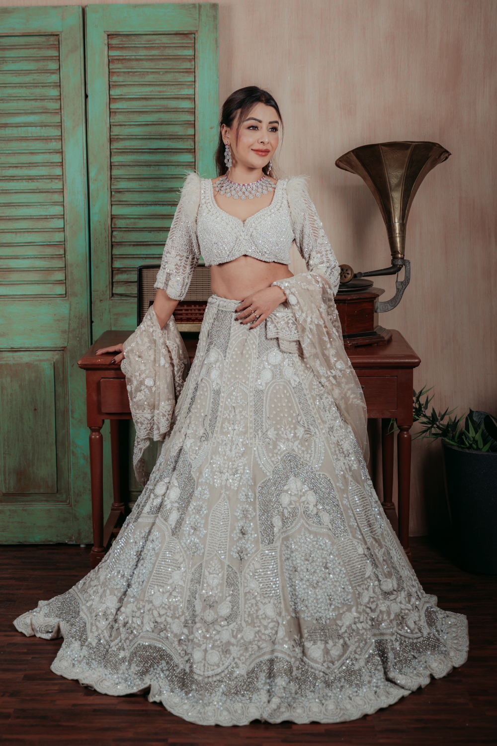 Ivory Cream Bridal Trail Lehenga With Thread Work And Silver Sequin Embellishment