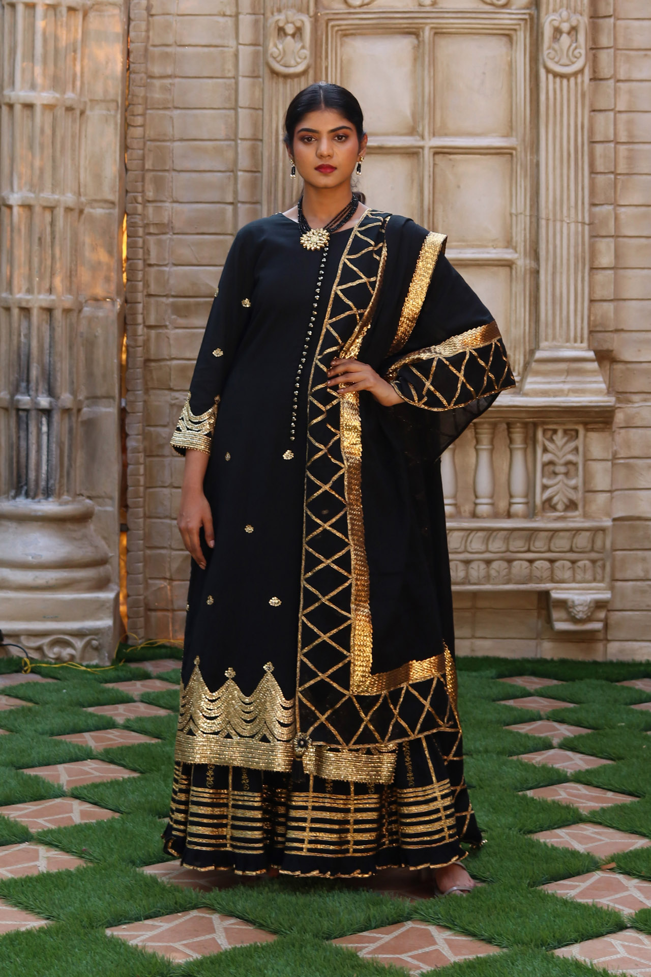 1. BLACK SHARARAS WITH SEQUINS AND GOTA