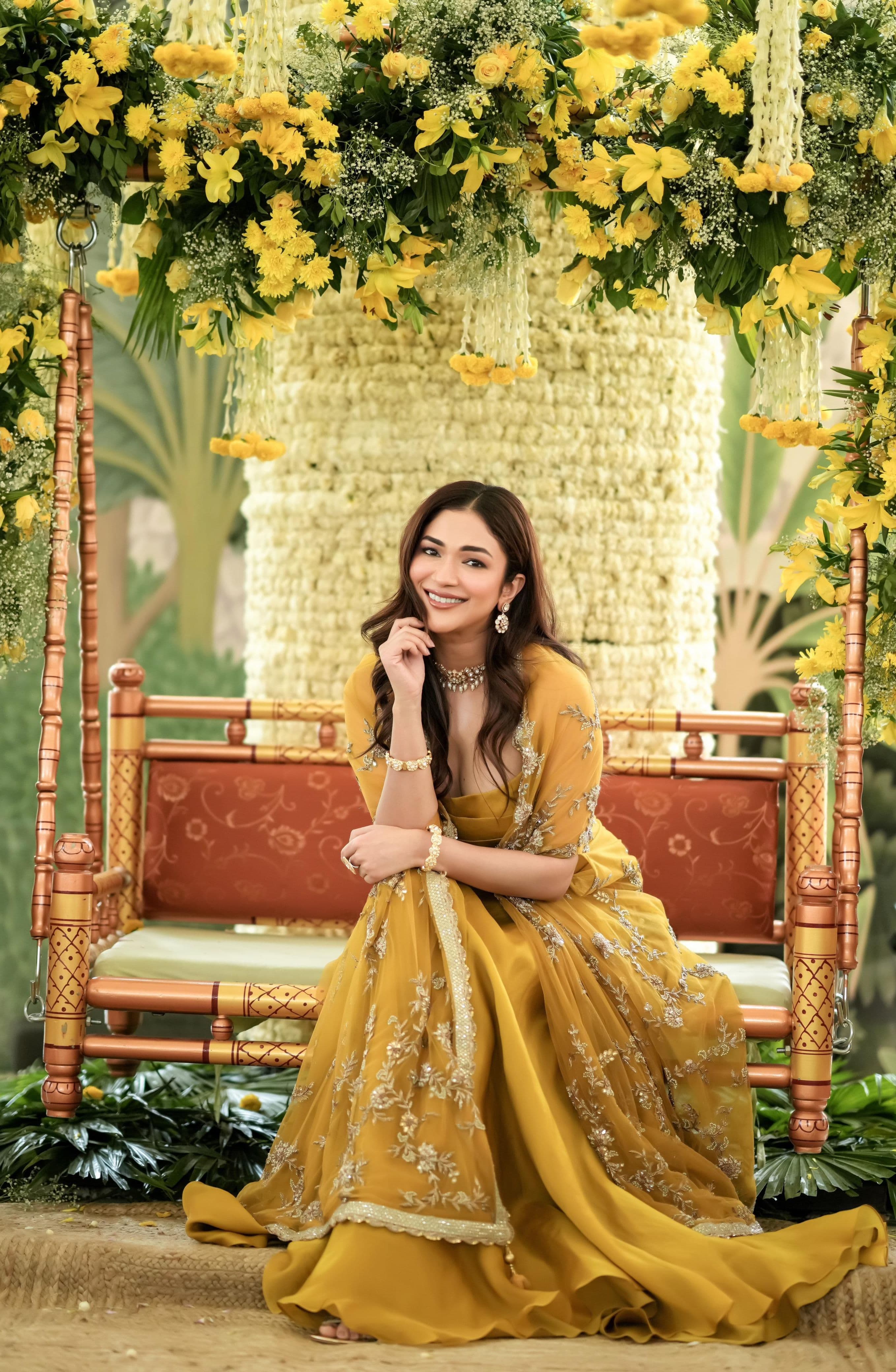 Mustard yellow skirt and draped top set with heavily embellished cape