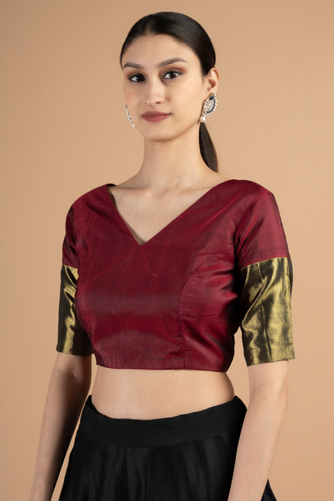 Red blouse with green sleeve