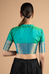 Full neck turquoise blouse with silver borderDSC00910