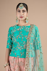 Marine green waist length blouse paired with peach lehenga setDSC08977