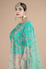 Marine green waist length blouse paired with peach lehenga setDSC08978