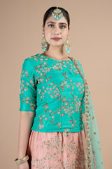 Marine green waist length blouse paired with peach lehenga setDSC08981
