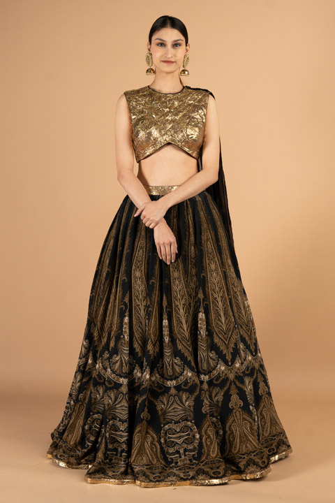 Printed skirt paired with gold blouse and detachable dupatta