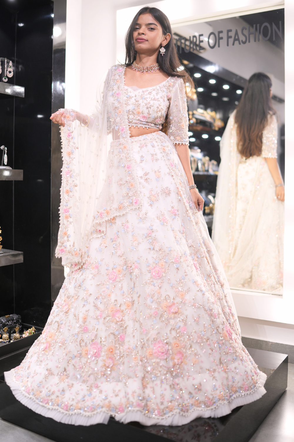 Ivory Lehenga With Pastel Floral Sequinned Embellishment