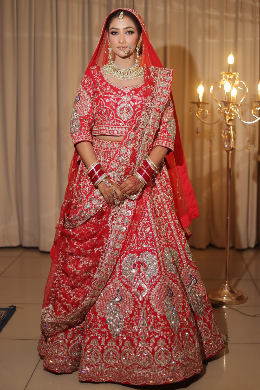 Red Bridal Lehenga In Peacock Floral Motif With Golden Zari Work Embellishment1