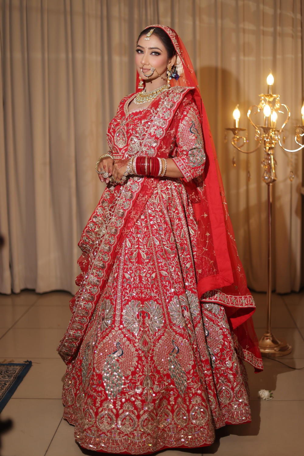 Red Bridal Lehenga In Peacock Floral Motif With Golden Zari Work Embellishment4