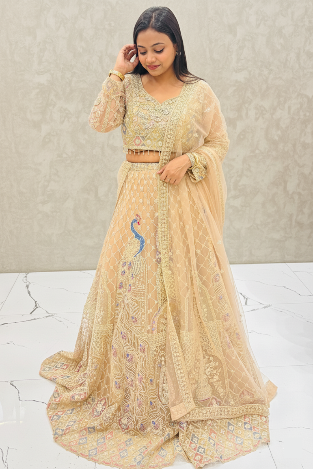 Soft Champagne Beige Lehenga With Peacock Motif Embellishment